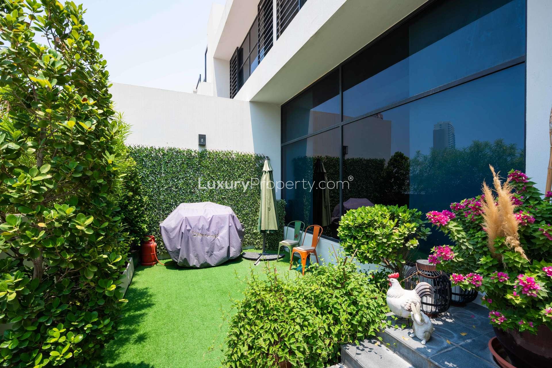 Luxurious villa garden with greenery and patio in Hyati Residences, Jumeirah Village Circle