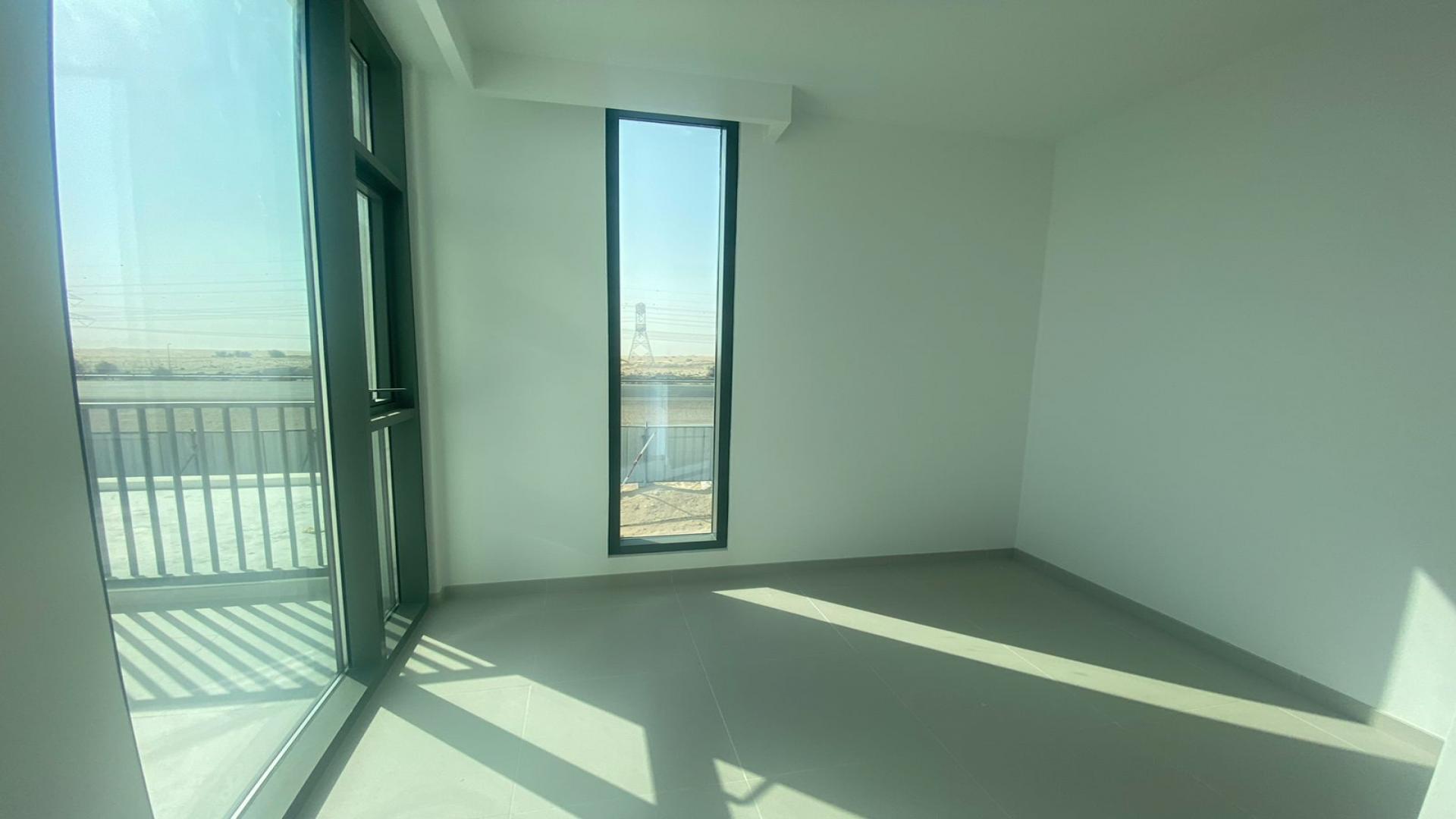 "Bright room with large windows in Joy villa, Arabian Ranches 3, for sale.",Modern kitchen in brand new 4-bedroom villa, Arabian Ranches 3, Joy community, for sale