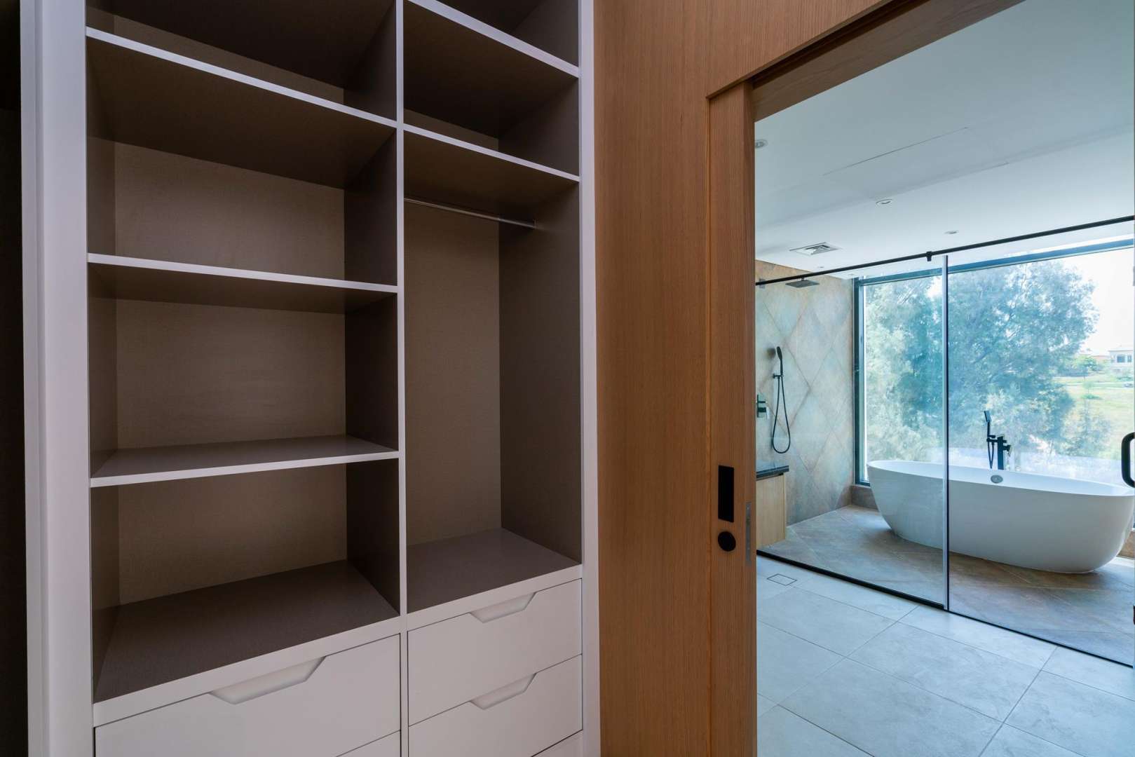 Modern townhouse exterior at Jumeirah Luxury Living, Dubai, with spacious parking area