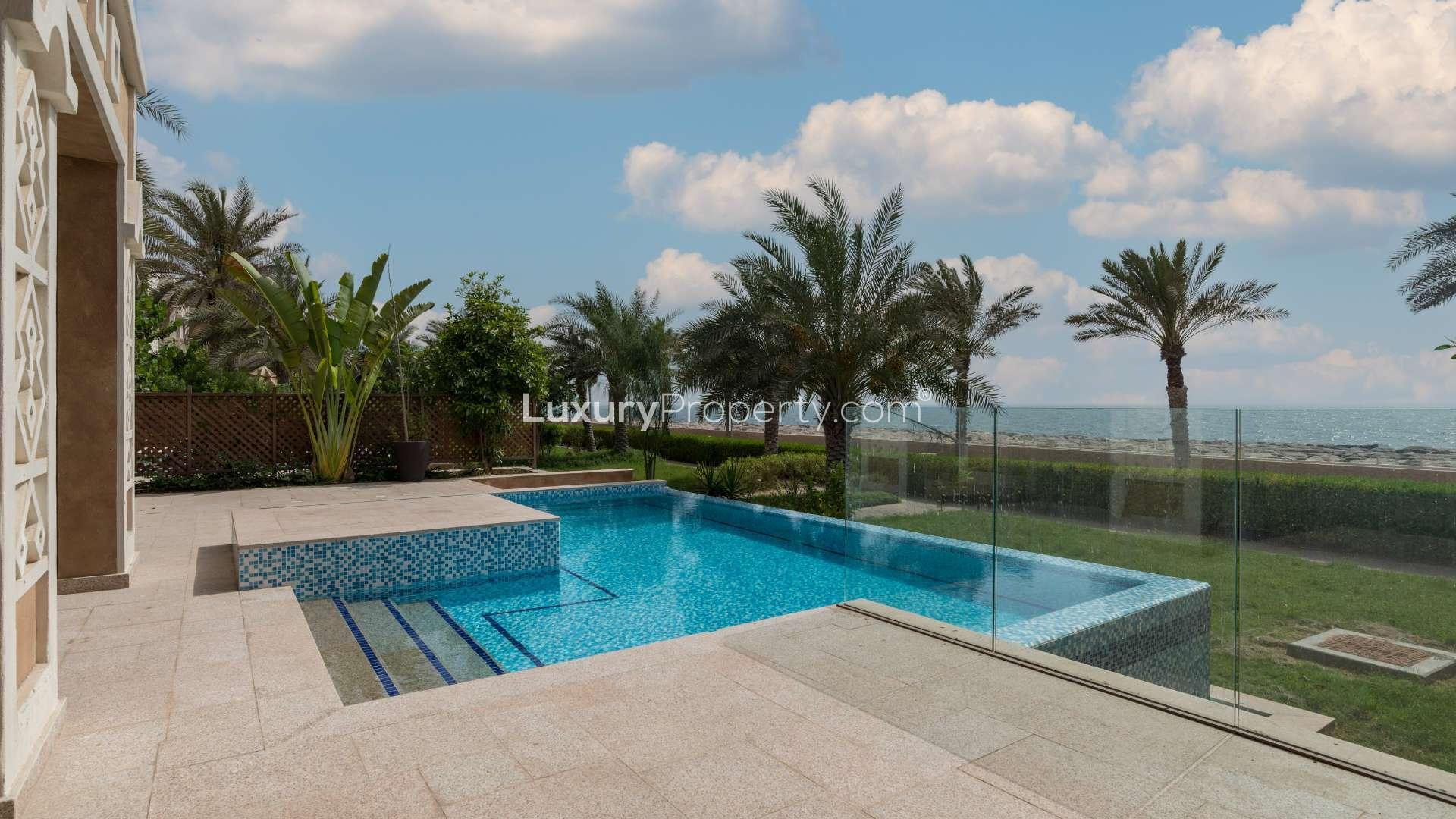 "Palm Jumeirah villa with sea view, sunset, and pool in Kingdom of Sheba community.",Luxury Palm Jumeirah villa with private pool and sea view in Kingdom of Sheba