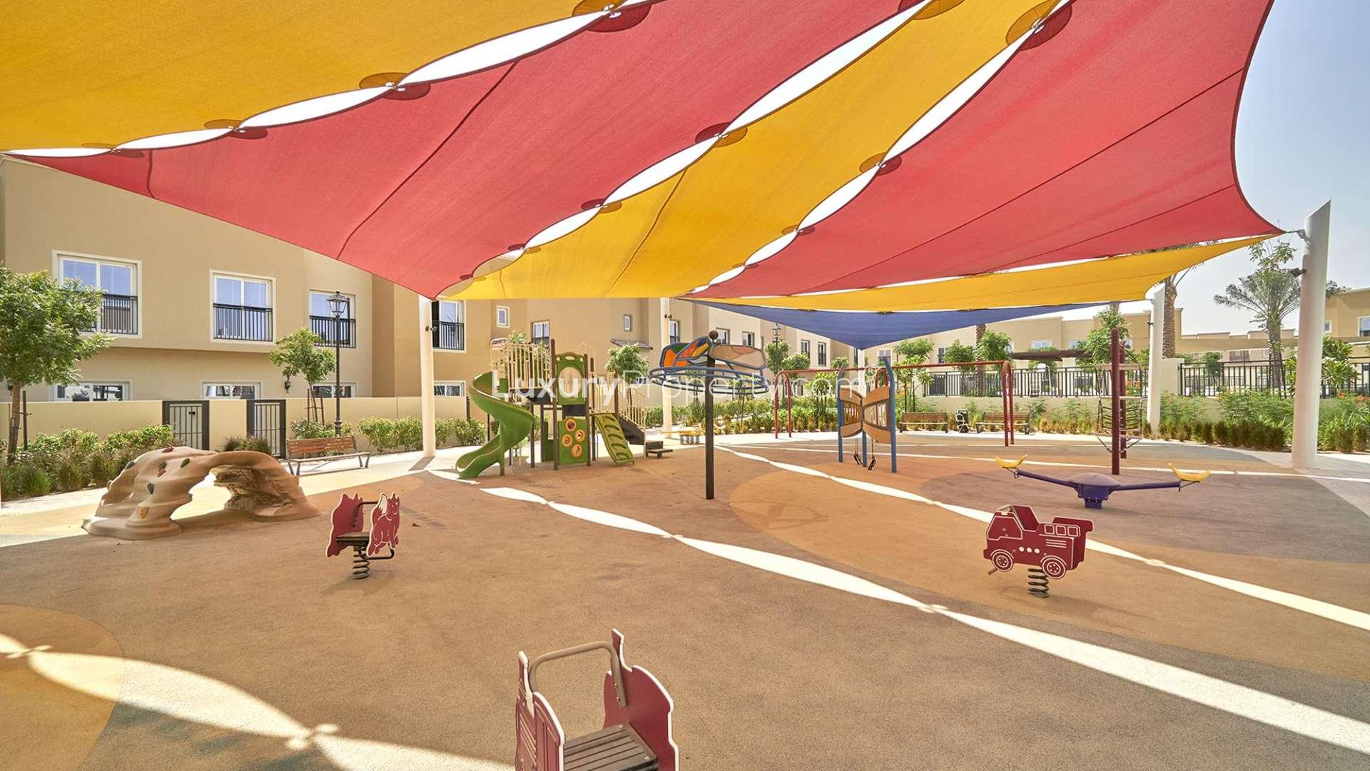 Row of stylish villas on a sunny street in La Quinta, Villanova community