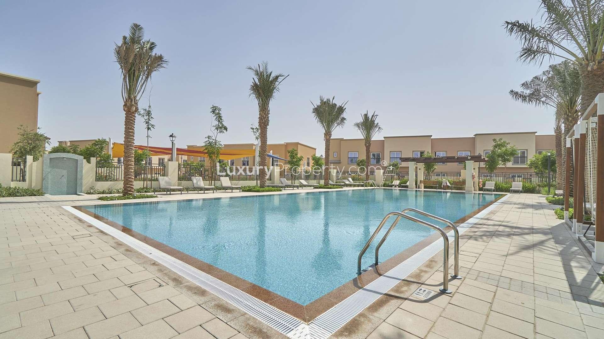 Outdoor pool area at four-bedroom villa in La Quinta, Villanova, for sale