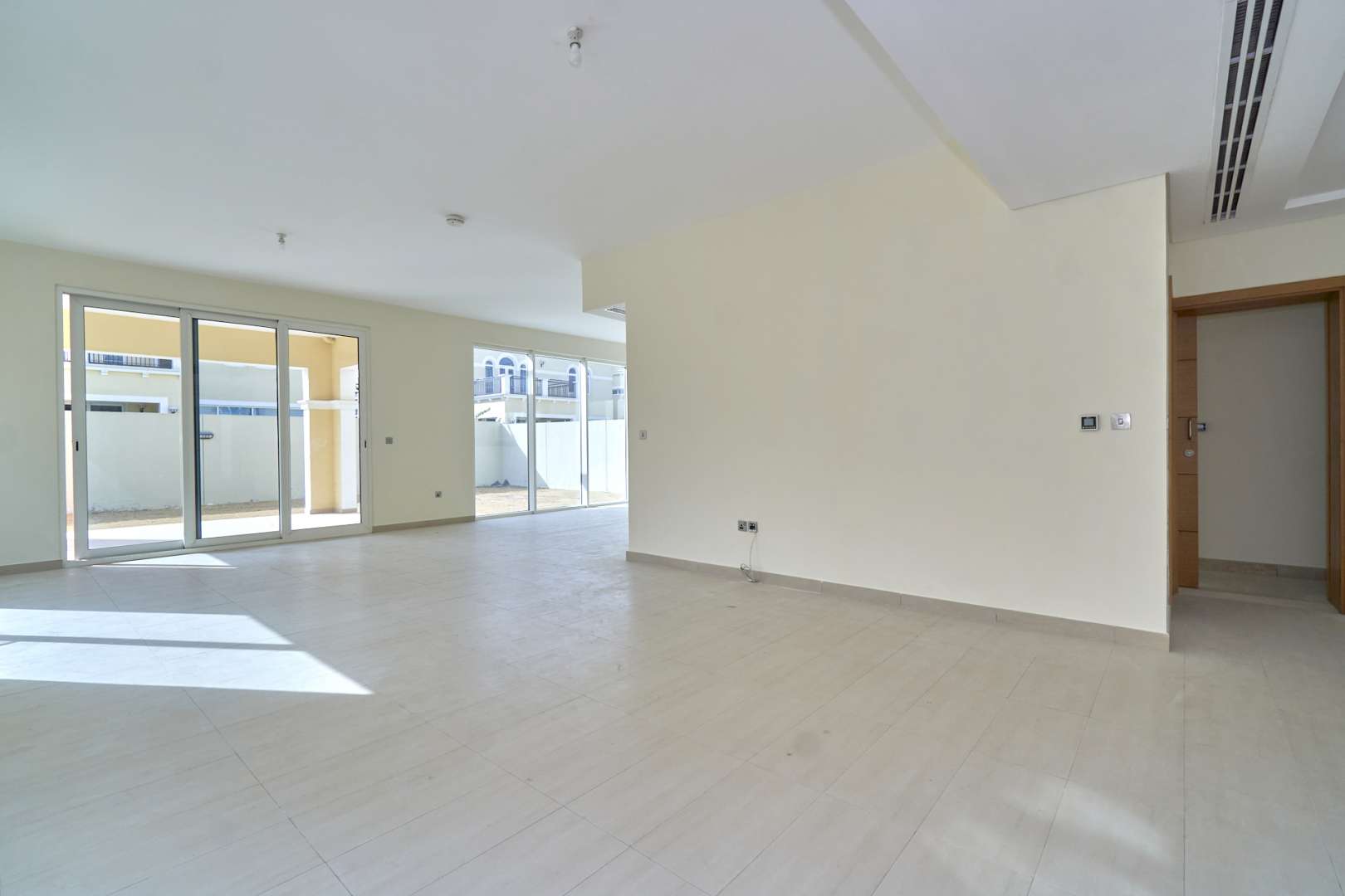 Villa exterior in Jumeirah Park's Legacy Nova Villas, featuring modern architecture and spacious design