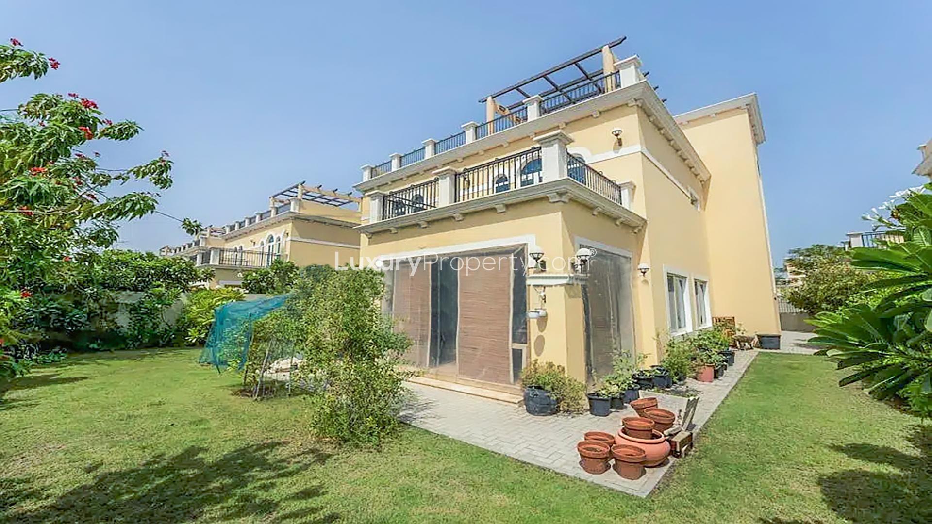 Exterior view of Legacy Nova Villa in Jumeirah Park, showcasing lush garden and architecture