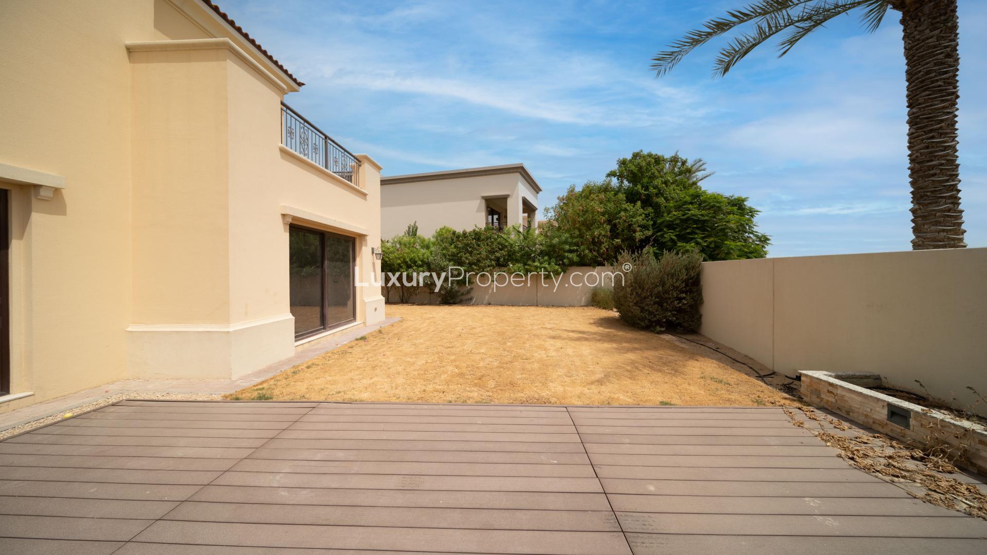 Villa exterior in Arabian Ranches 2, Lila community, featuring spacious backyard and patio