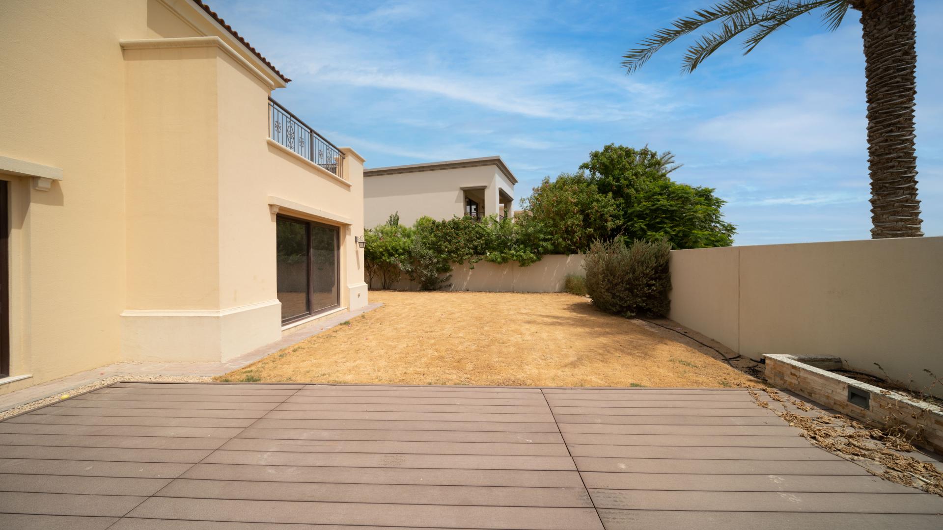 Villa exterior in Arabian Ranches 2, Lila community, featuring spacious backyard and patio