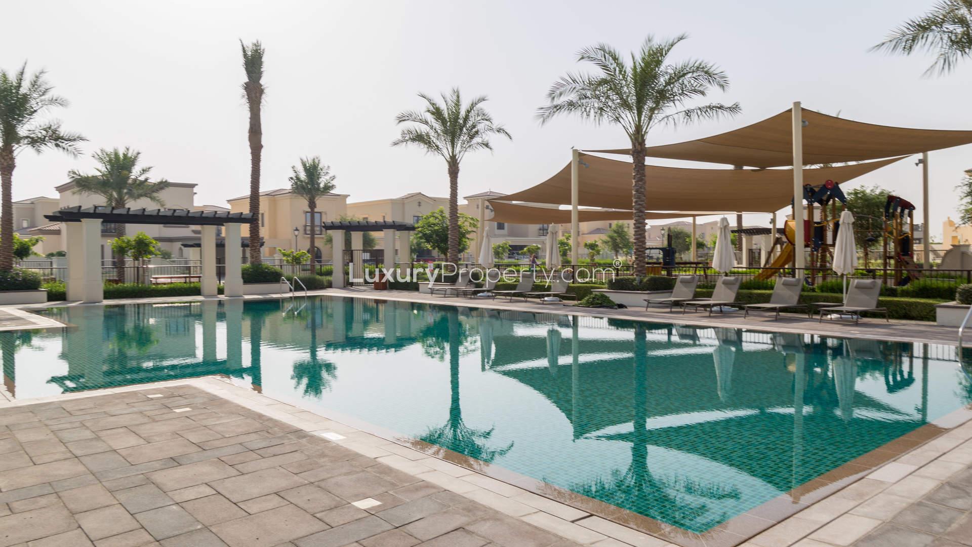 Lush garden entrance at Lila Arabian Ranches 2, showcasing vibrant landscaping