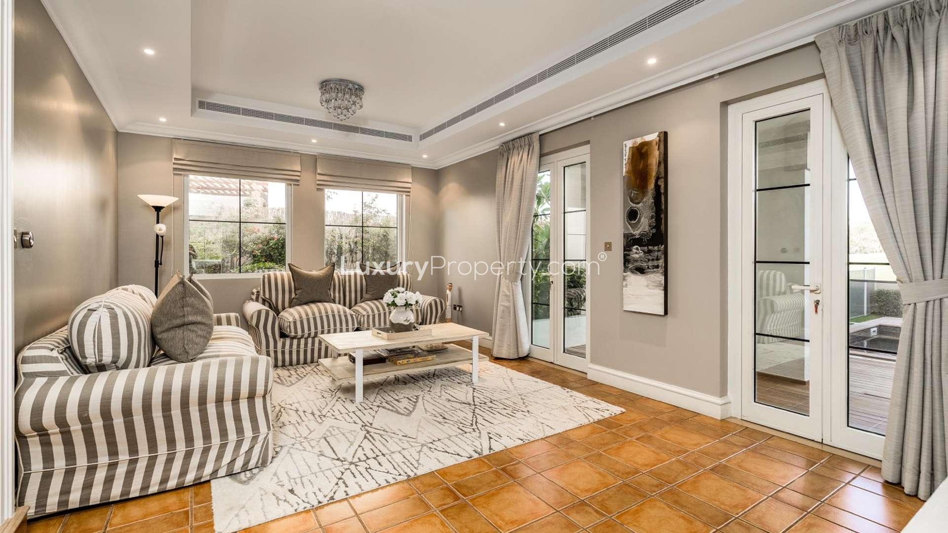 Luxurious bedroom in Almeria villa with lake view at Jumeirah Golf Estates, Earth