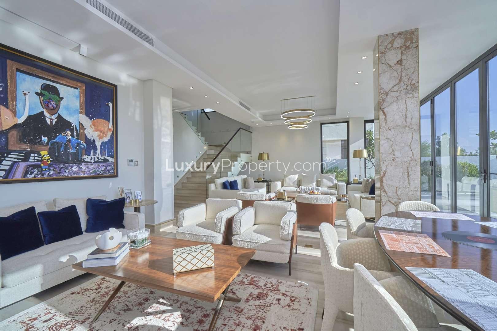 Luxurious bedroom in upgraded Damac Hills villa with elegant decor and large window view