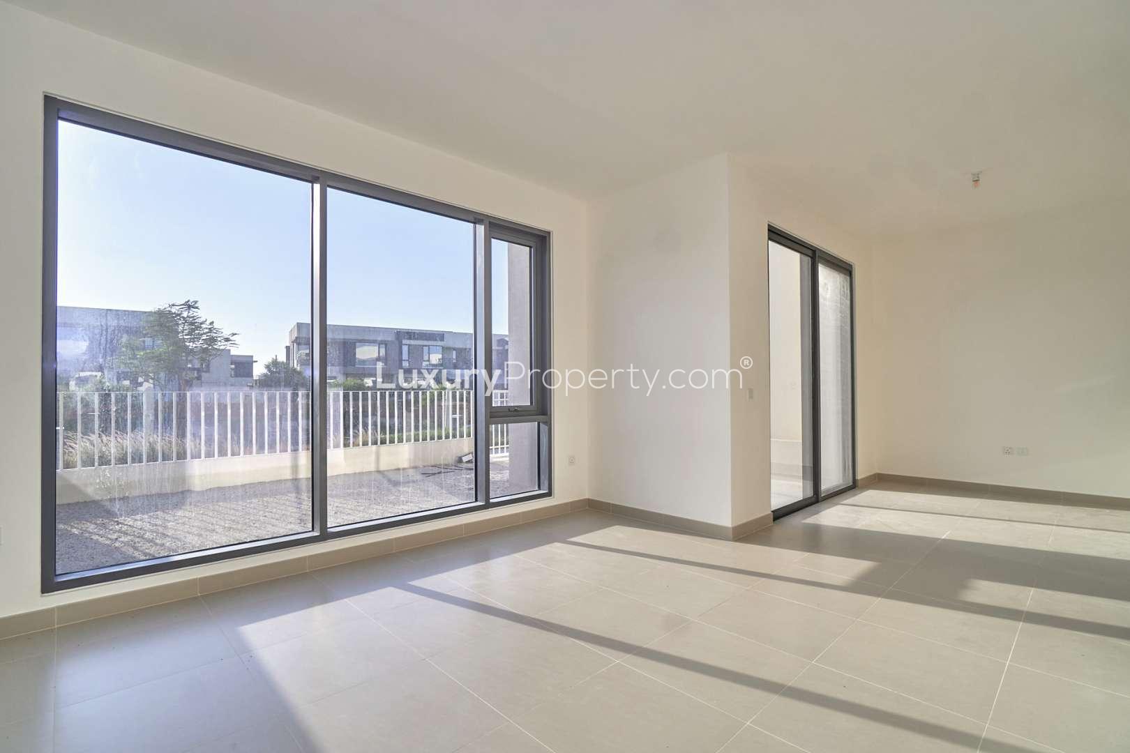 Modern villa exterior with driveway in Maple, Dubai Hills Estate, four-bedroom home for sale