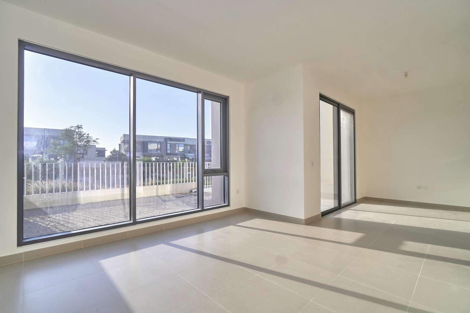 Modern villa exterior with driveway in Maple, Dubai Hills Estate, four-bedroom home for sale