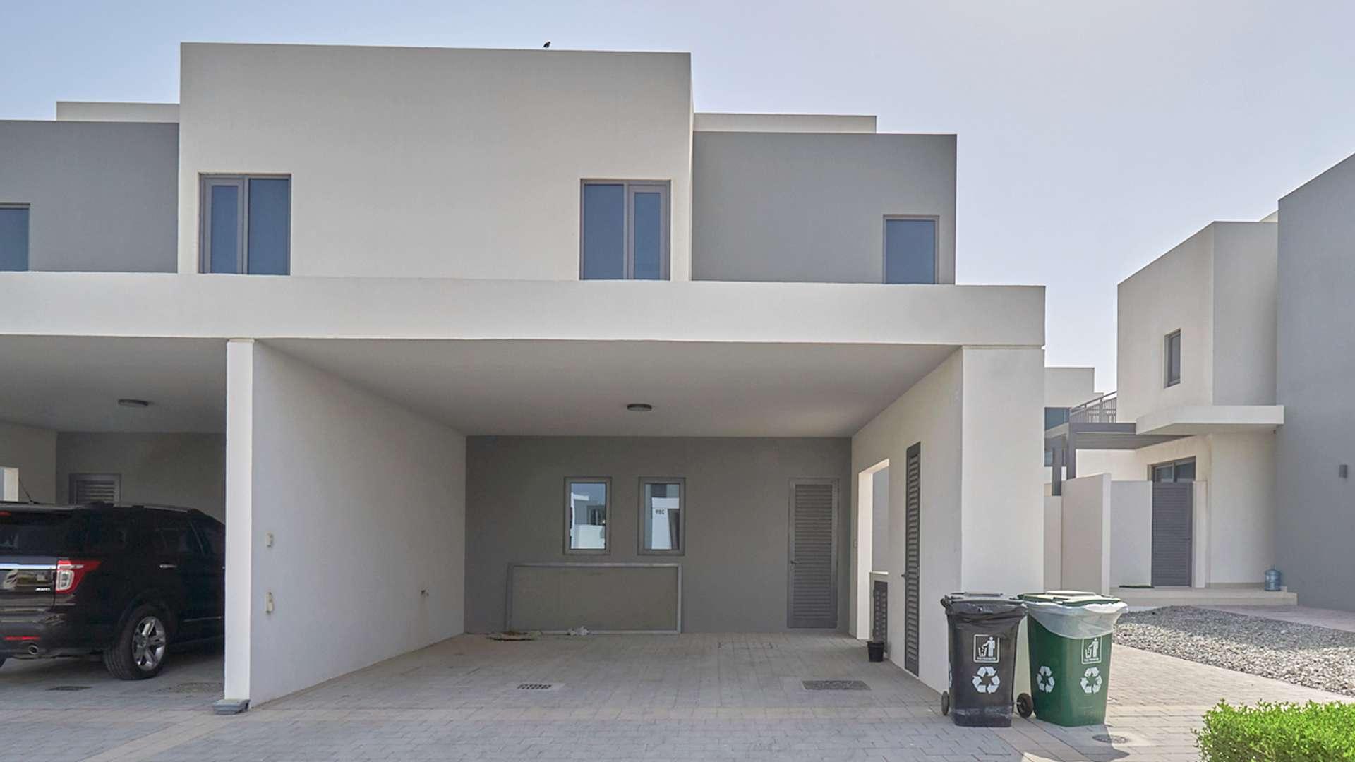 Upgraded townhouse exterior in Maple, Dubai Hills Estate, showcasing modern architecture and spacious yard