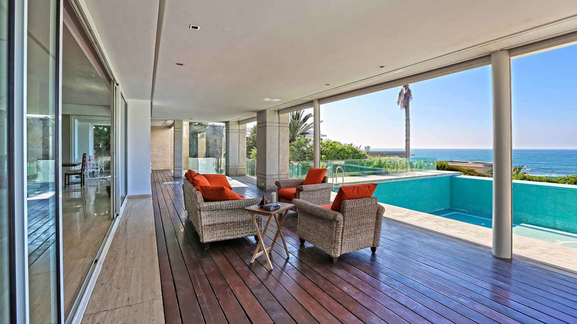 Luxurious Harhoura villa with ocean view, pool, and elegant outdoor seating area