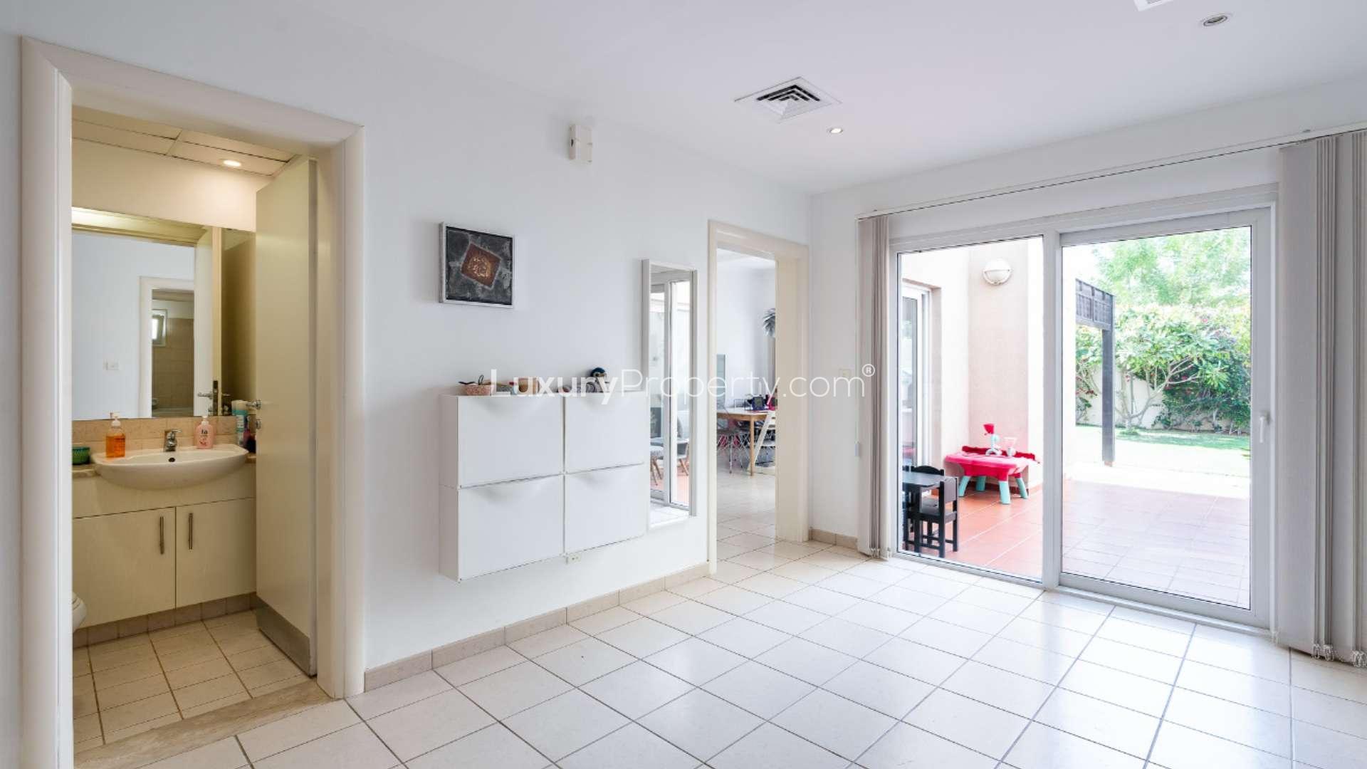 Beautiful 4-bedroom villa exterior with lush garden in Meadows 5, Dubai for sale