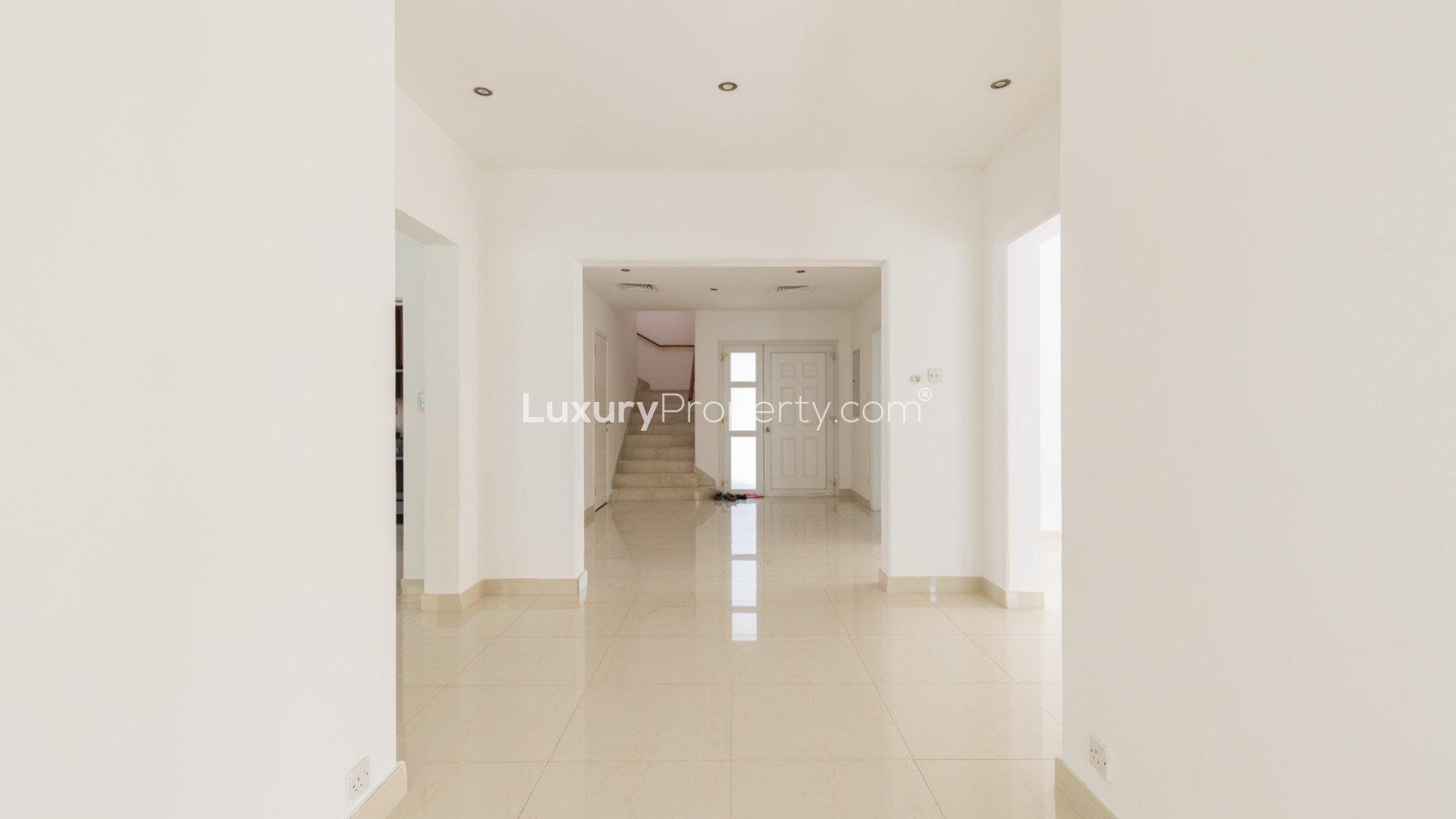 Upgraded villa entrance with garden in Meadows 9, Dubai. Quiet location, for sale