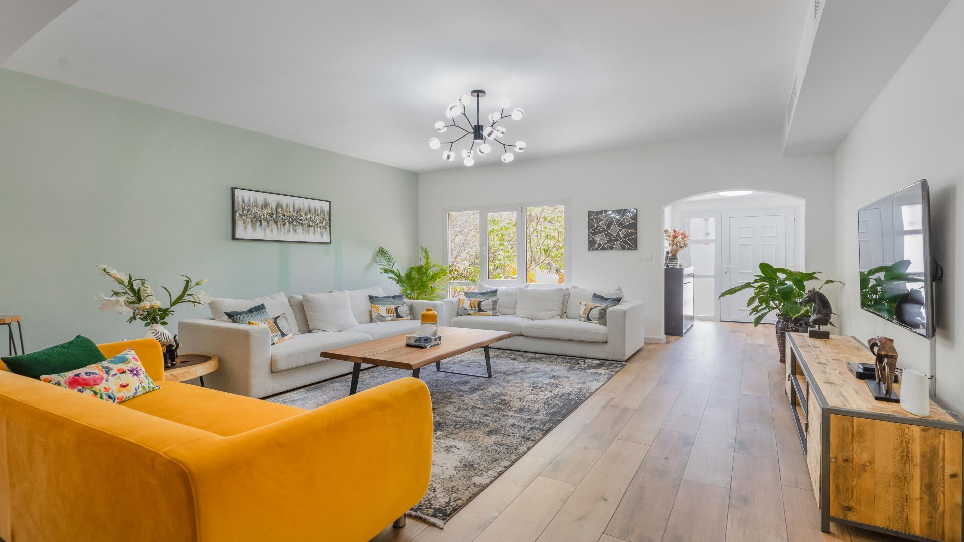 Spacious living and dining area in upgraded four-bedroom villa, Meadows 9, for sale