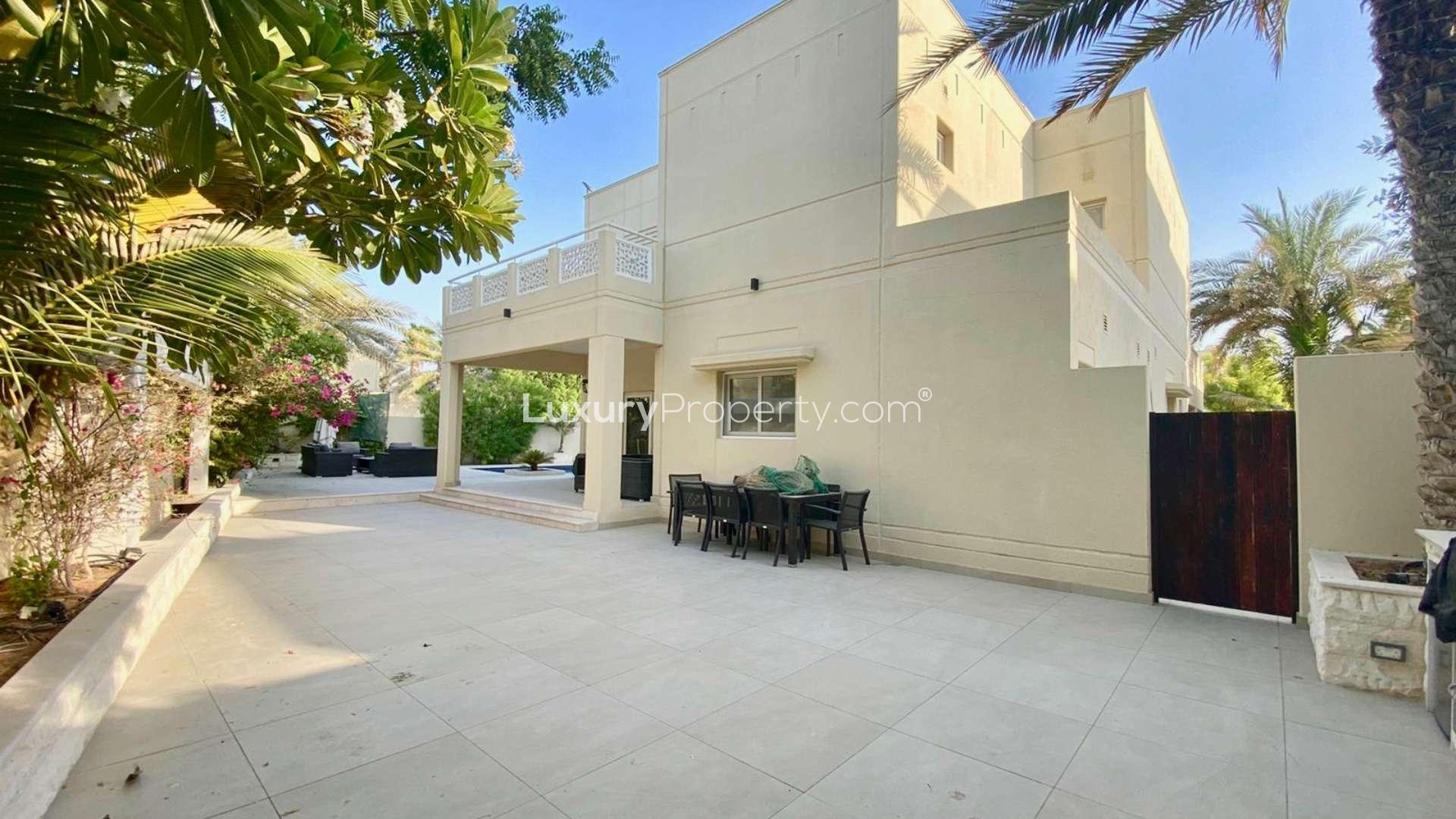 Luxurious living room in Meadows 9 villa with elegant furnishings and dining area