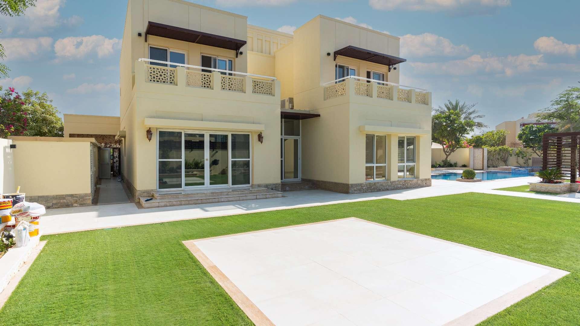 Empty room with marble floors and garden view in Meadows 2 villa for sale