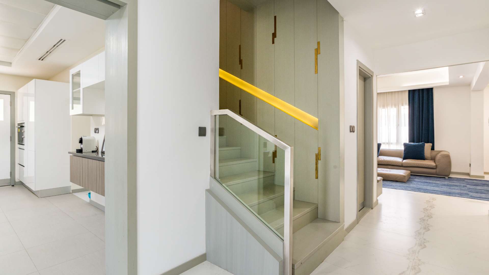 Modern staircase and cozy living area in Meadows 2 villa, Dubai