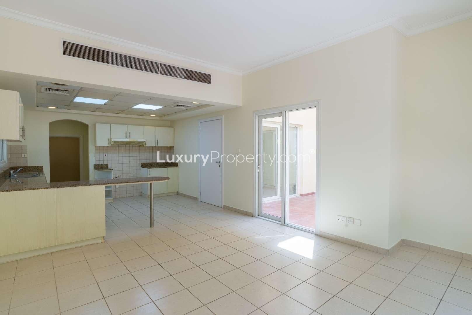 Spacious kitchen in 4-bedroom villa for sale, Meadows 2, with garden views