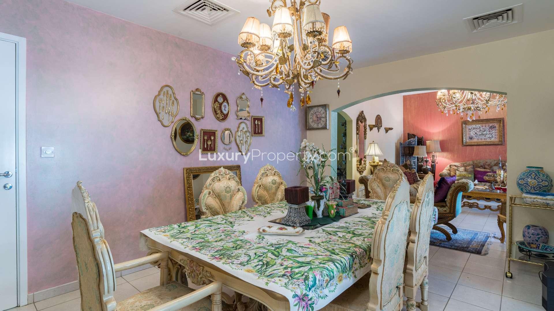 Luxurious living room in 4-bedroom villa, Meadows 9, Dubai, with elegant decor and chandelier