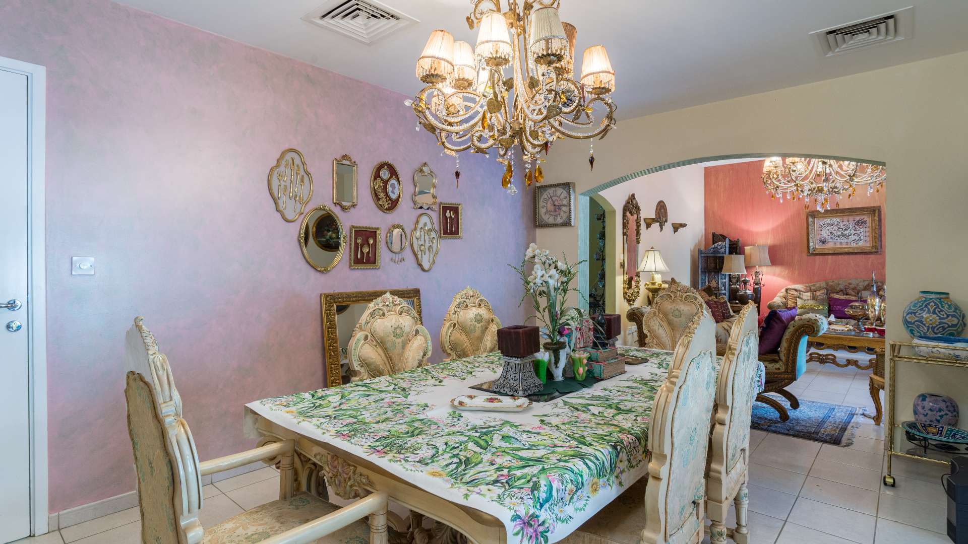 Luxurious living room in 4-bedroom villa, Meadows 9, Dubai, with elegant decor and chandelier