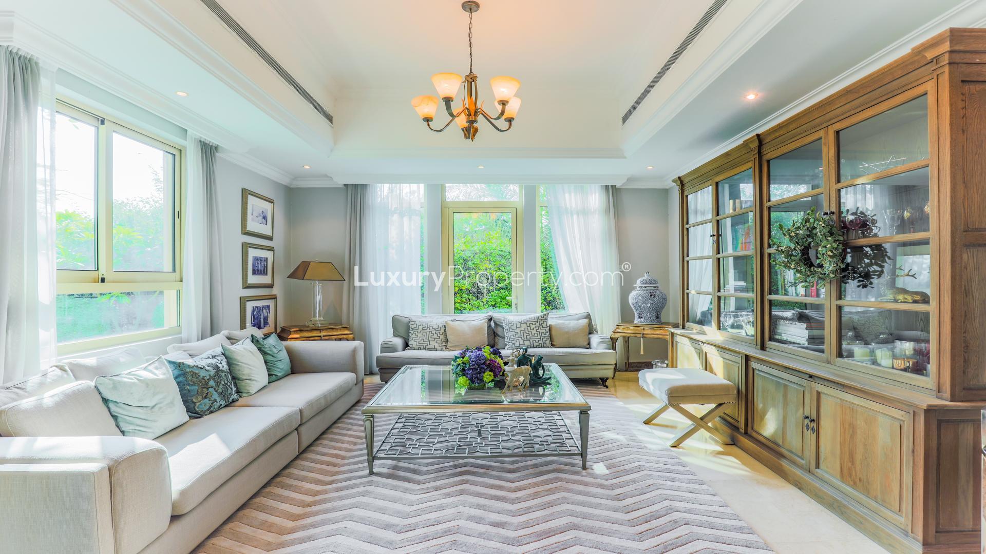 Luxurious living room in Spanish-inspired villa, Jumeirah Islands, with elegant decor and natural light