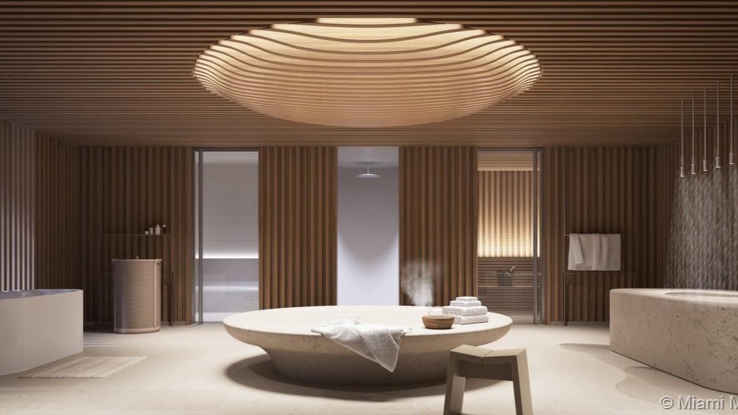 Outdoor dining area with ocean view at 4-bed villa, 8701 Collins Ave, Miami