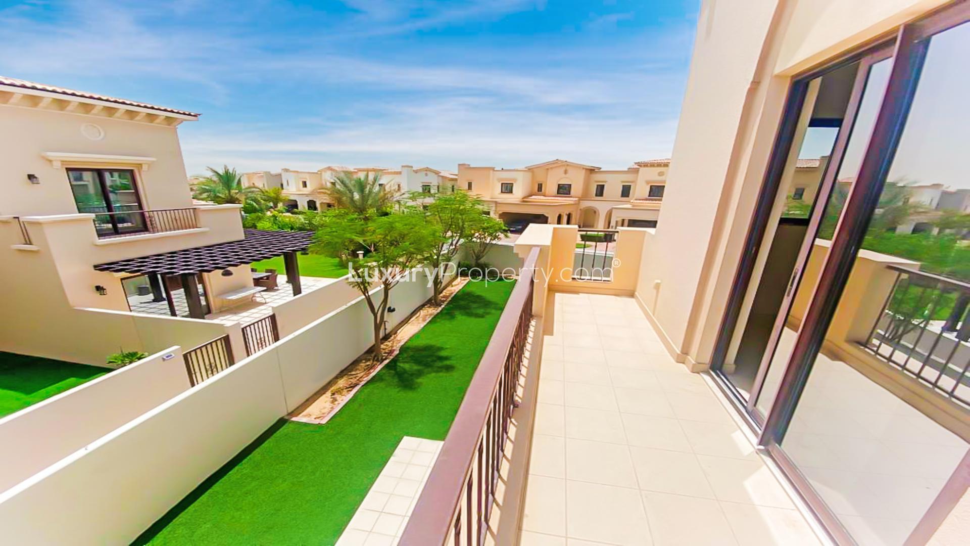 Spacious kitchen with wooden cabinets in Mira villa, Reem community, available for rent