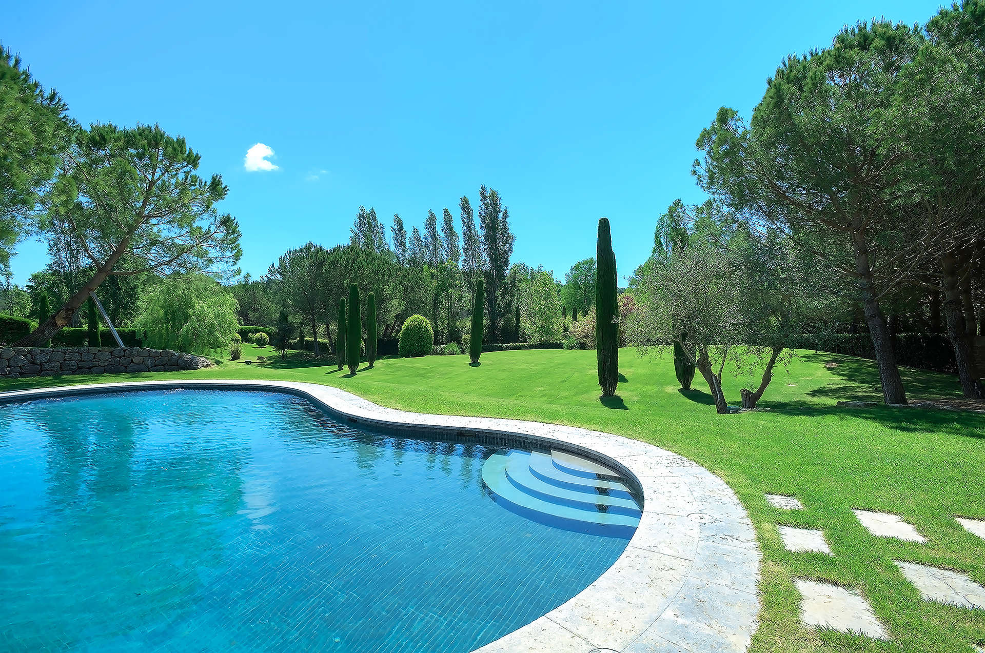 Luxurious bedroom in fully renovated villa, Mougins, French Riviera, with garden views