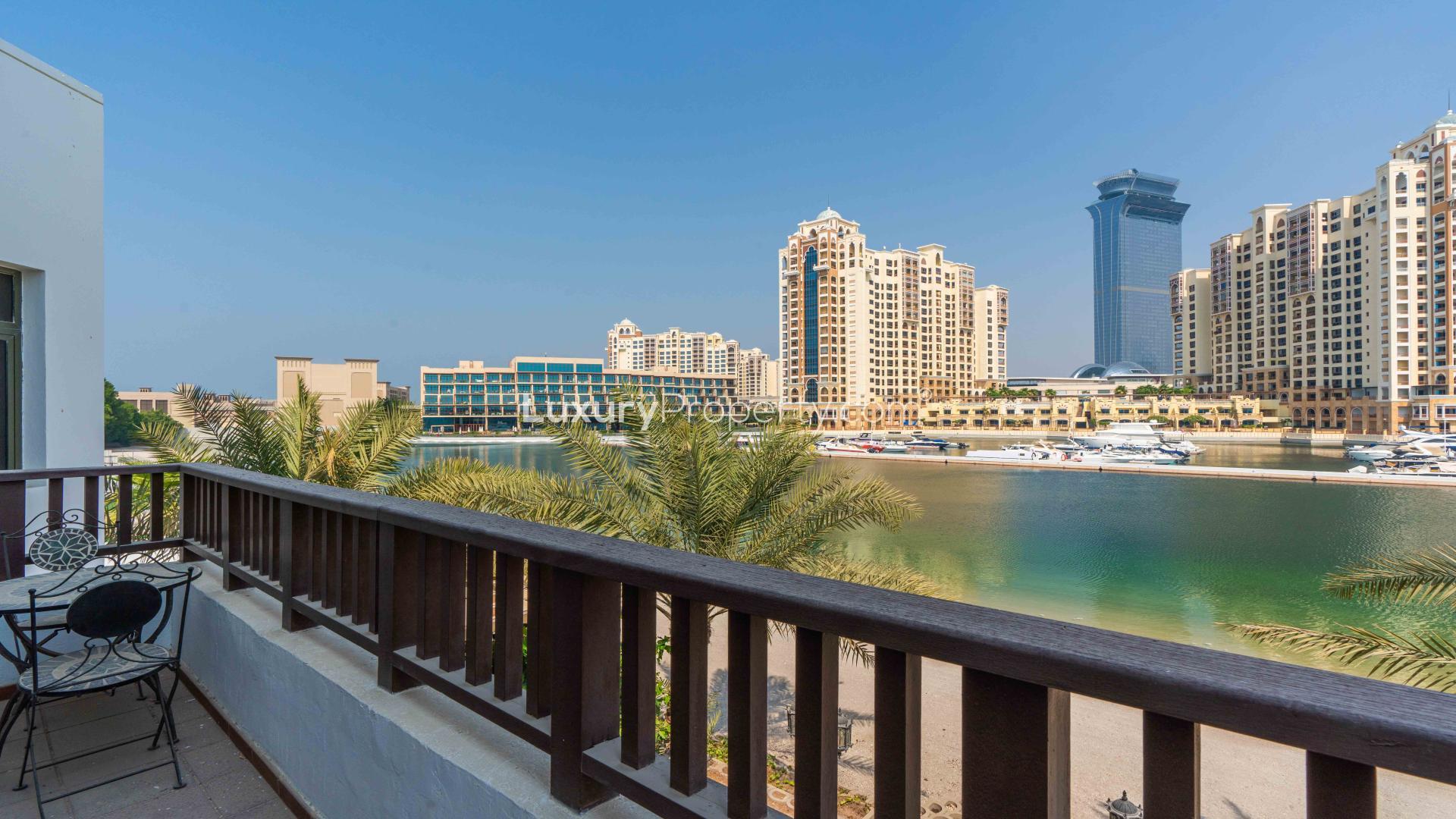 "Modern 4-bed villa exterior with pool in Palm Jumeirah's Garden Homes community.","Palm Jumeirah villa balcony view with waterfront and skyline, Garden Homes Frond P.",Palm Jumeirah Garden Homes villa with private pool and marina views for sale