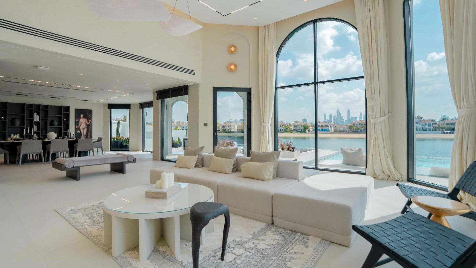 Luxurious Palm Jumeirah villa living room with waterfront views and modern decor