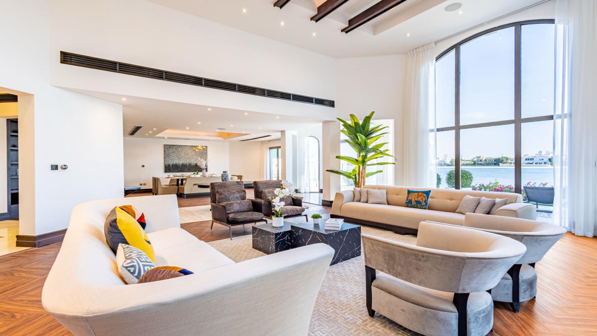 Luxurious living room in fully renovated Palm Jumeirah villa with modern decor and open layout