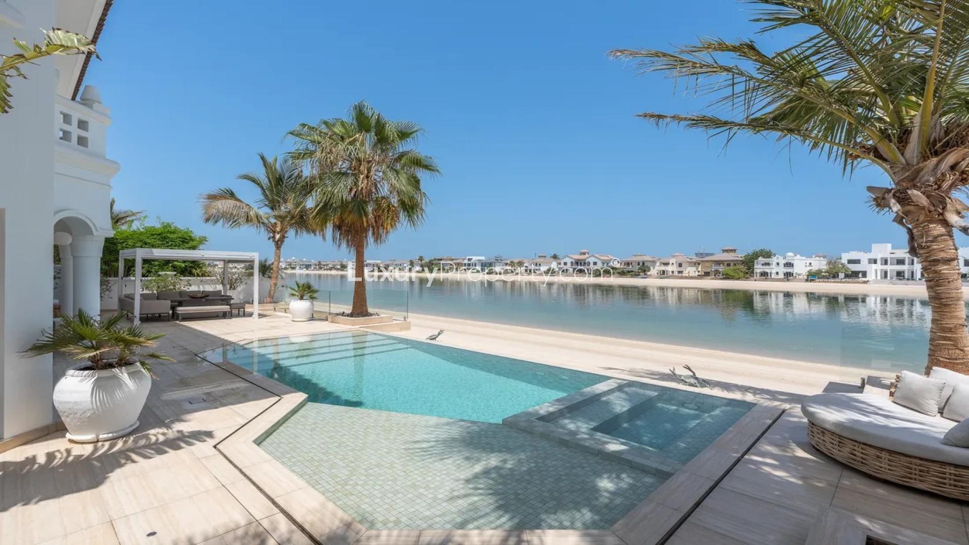 Luxurious living room in Palm Jumeirah villa with waterfront view, modern decor, and natural light