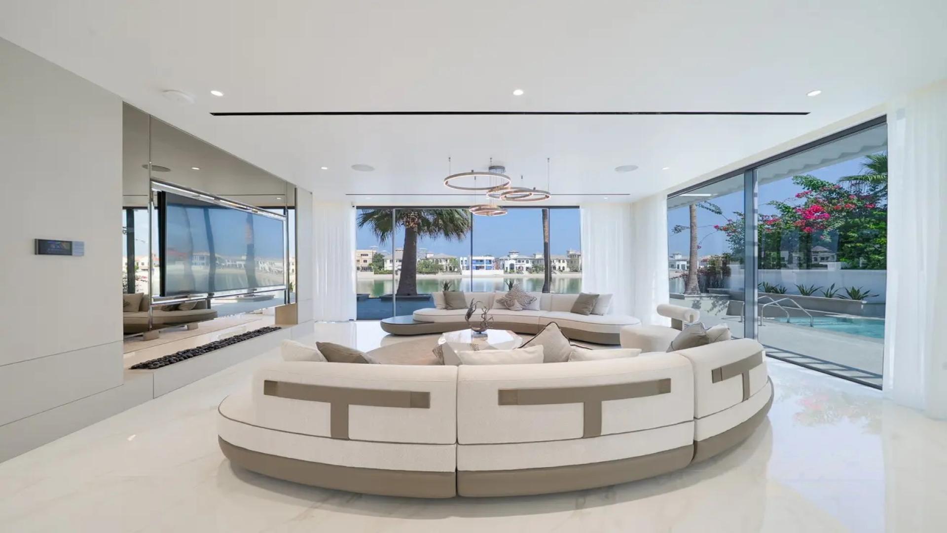 Brand new Palm Jumeirah villa with modern design, ample natural light, and sunset views