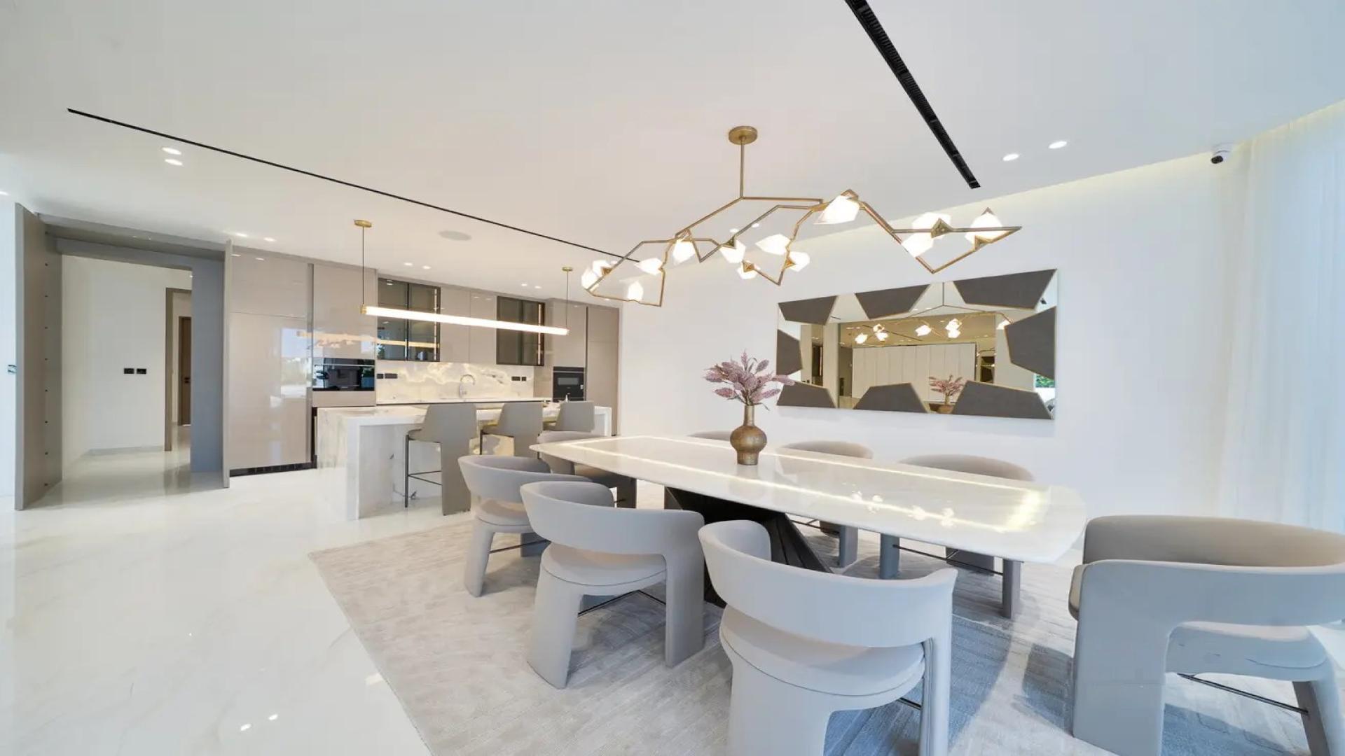 Luxurious Palm Jumeirah villa living room with pool view and modern furnishings