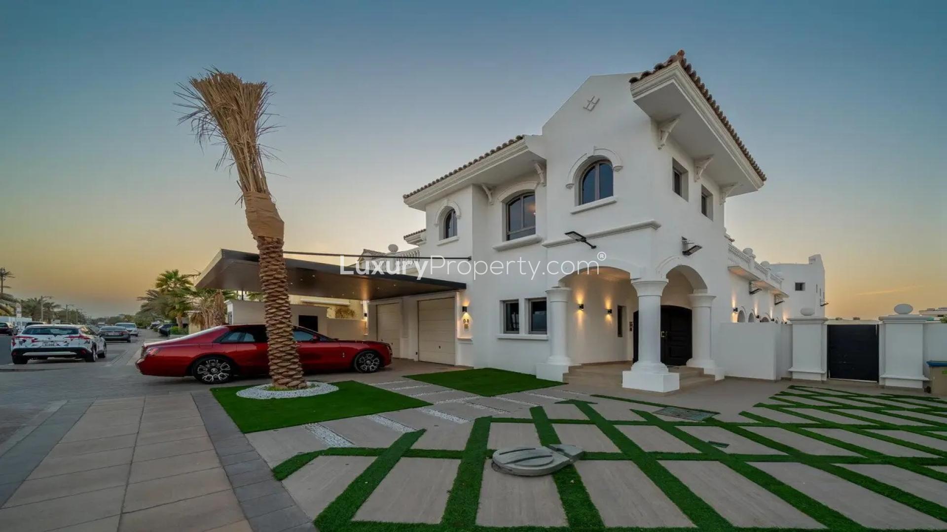 Luxurious living room in Palm Jumeirah villa overlooking waterfront, modern decor, spacious layout