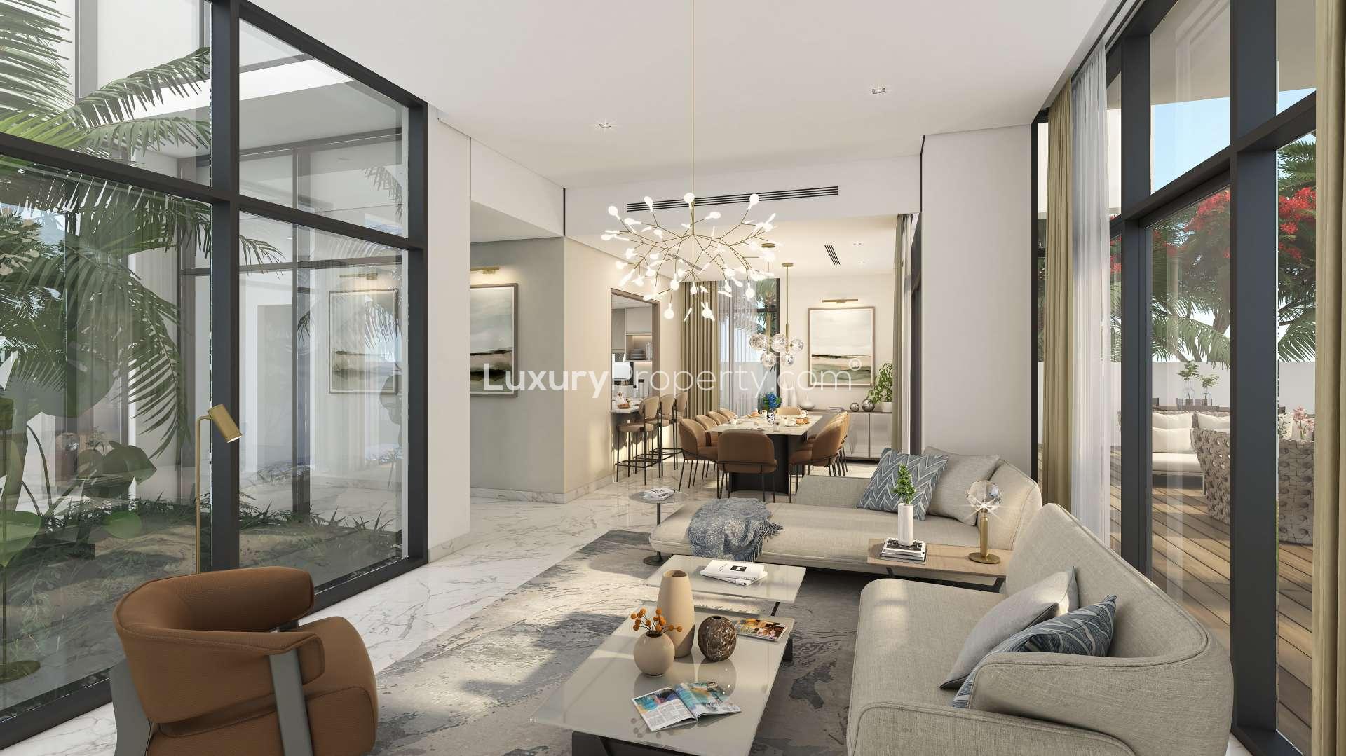 Modern 4-bedroom villa exterior in Murooj Al Furjan, Dubai, with lush landscaping