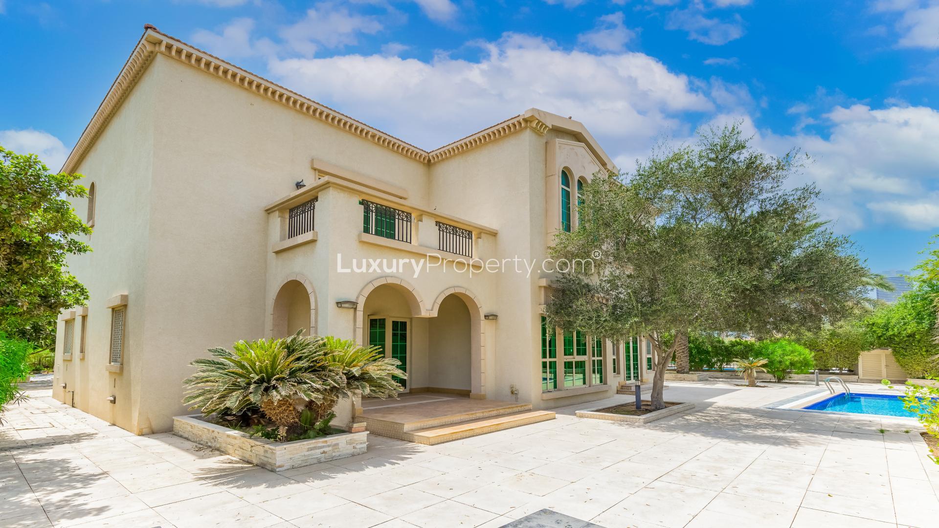 "Stunning villa balcony view in Oasis Cluster, Jumeirah Islands, surrounded by lush greenery.",Elegant 4-bedroom villa with pool in Oasis Cluster, Jumeirah Islands for sale