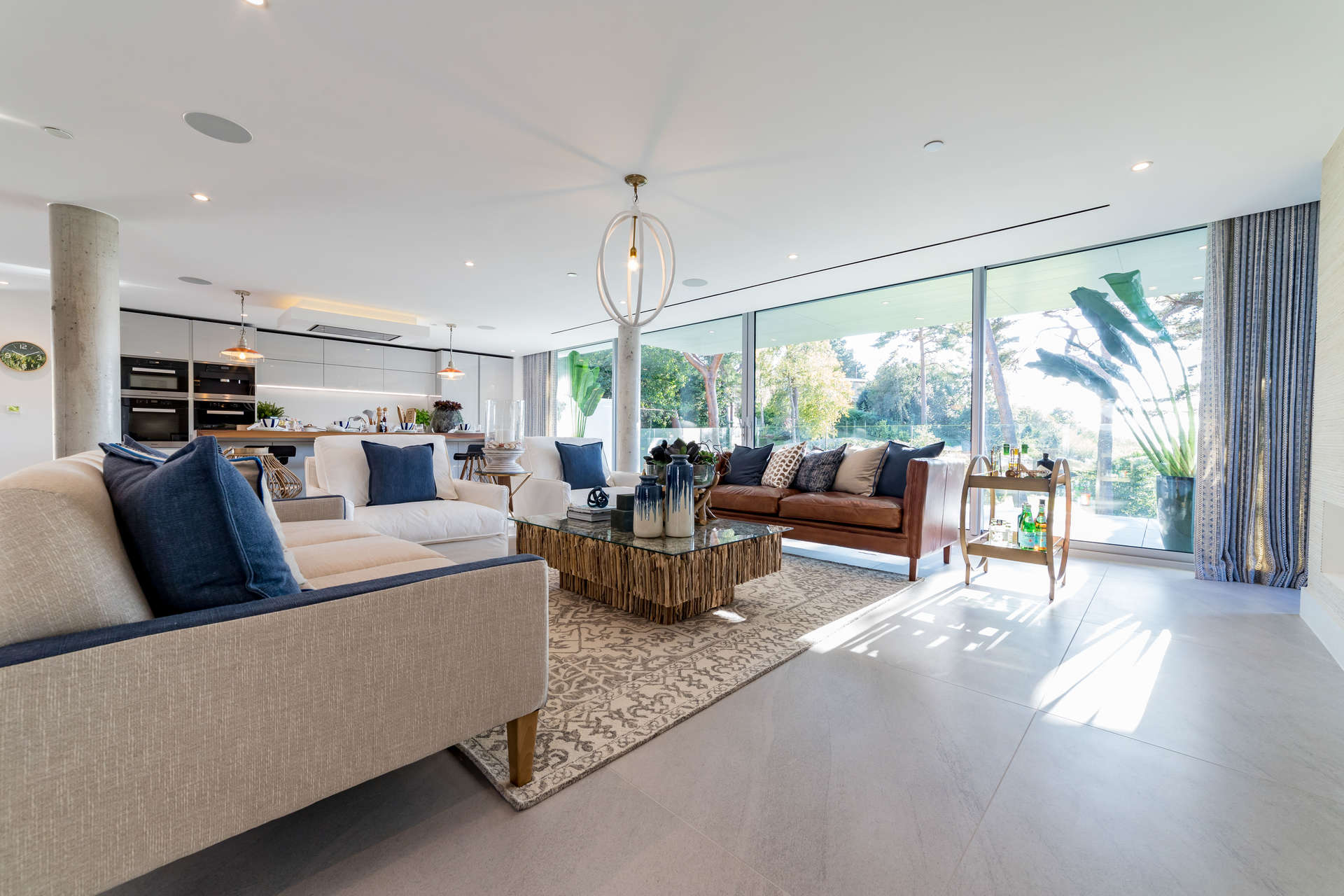 Contemporary living room in luxury villa, Canford Cliffs, with elegant decor and garden views