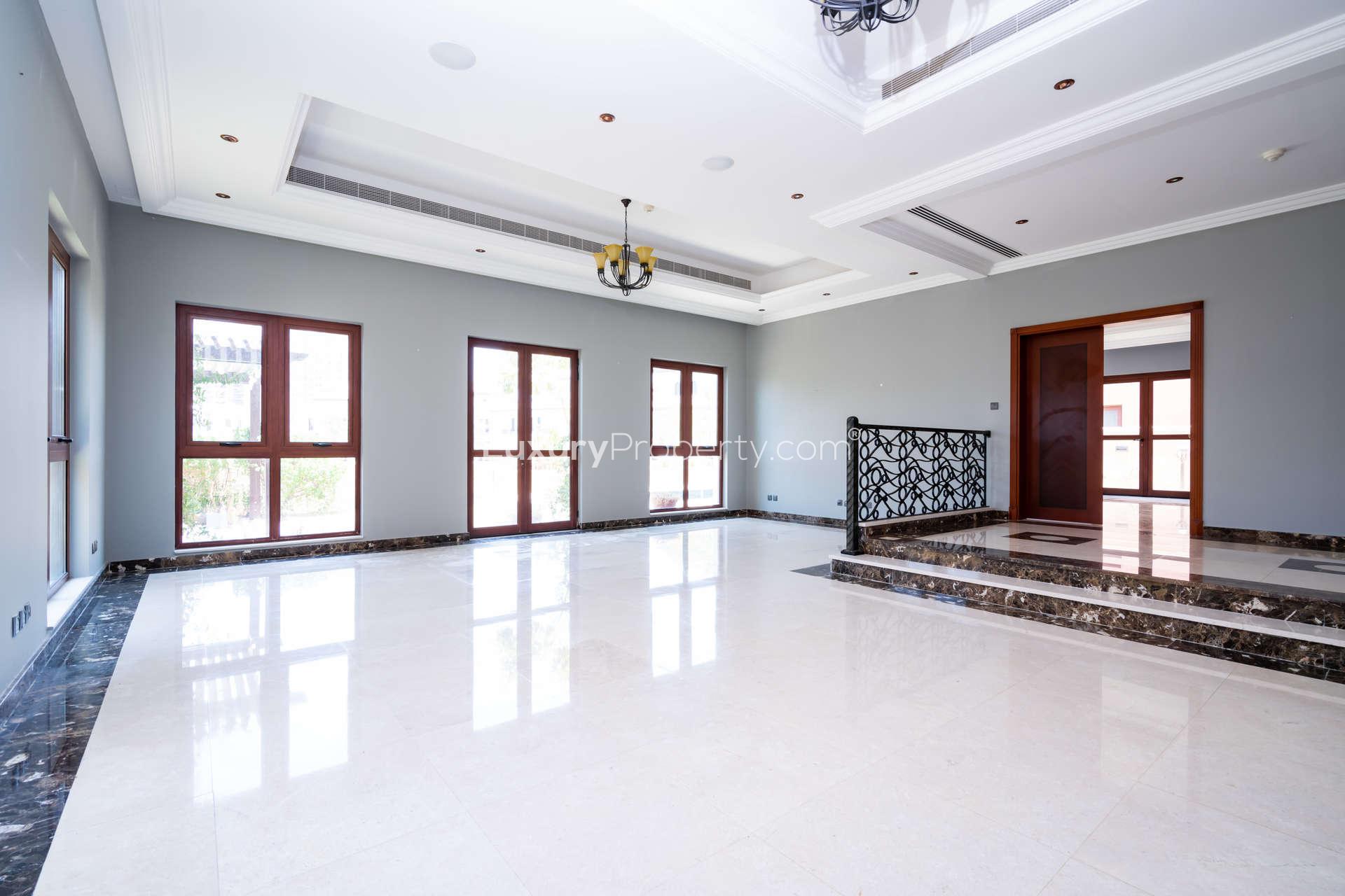 Spacious kitchen in 4-bedroom villa, Orange Lake, Jumeirah Golf Estates, with wooden cabinets