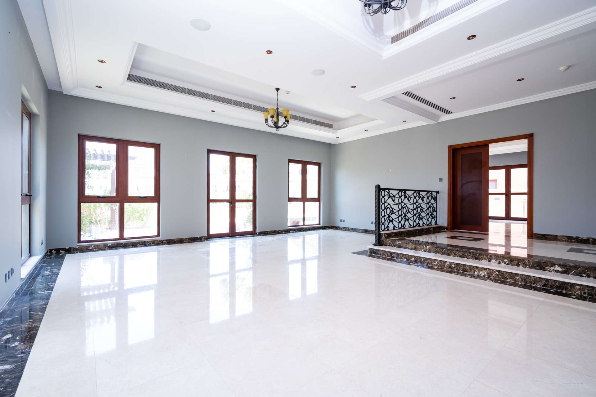 Spacious living room in 4-bedroom villa, Orange Lake, Jumeirah Golf Estates, marble floors, large windows