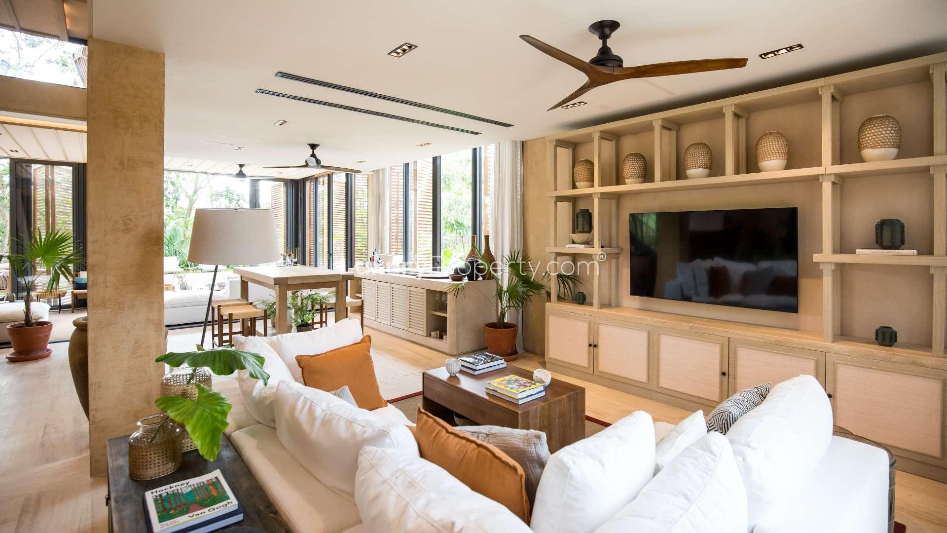 Luxurious living room in Corasol Riviera Maya villa, featuring modern decor and natural light