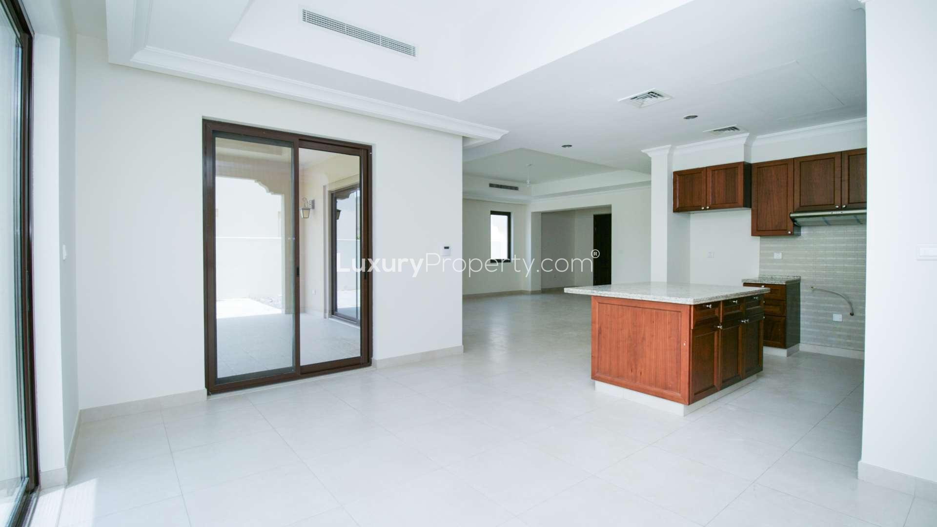 Spacious living room in Arabian Ranches 2 villa with large windows and modern design