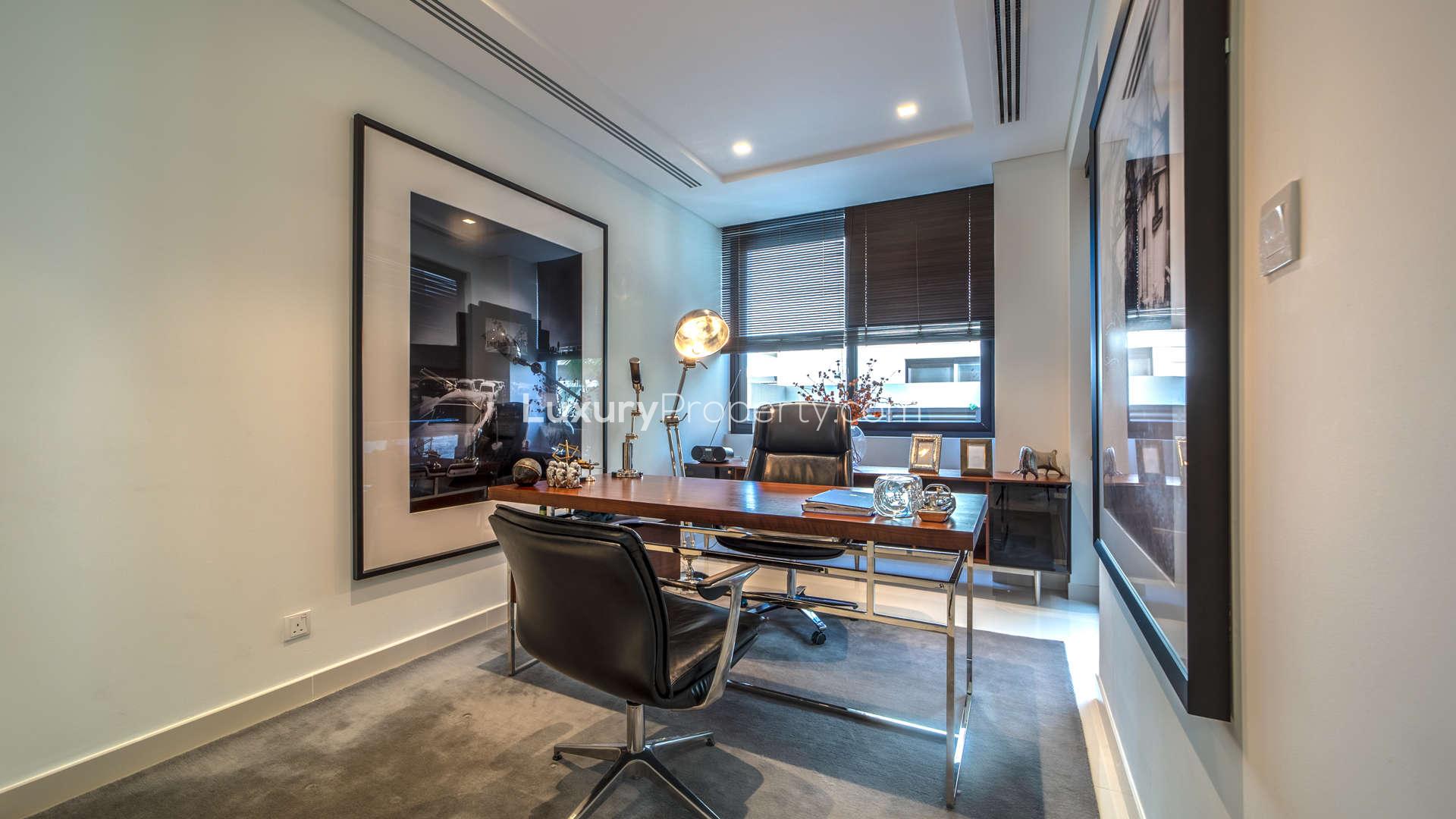 Modern kitchen in Piccadilly Green Villa, Damac Hills, Dubailand with sleek design and island seating