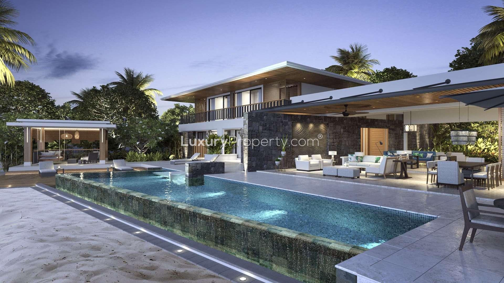 Luxurious Anahita villa living room with sea view, modern decor, spacious dining area