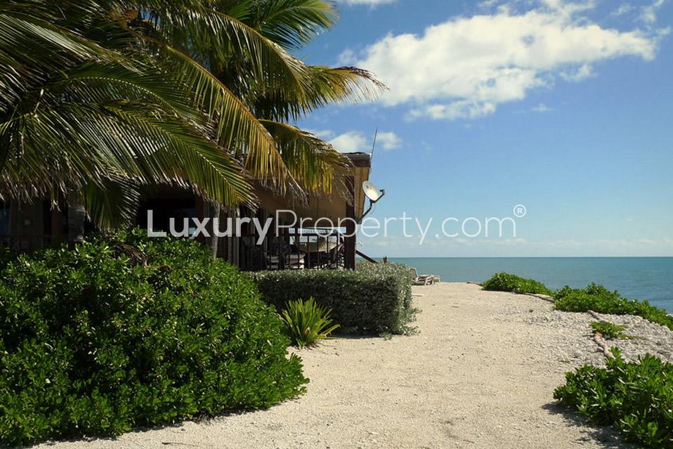 Private island villa in Florida Keys with beach, palm trees, and ocean view
