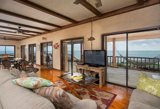 Helicopter landing pad on private island villa in Florida Keys, lush greenery surrounds