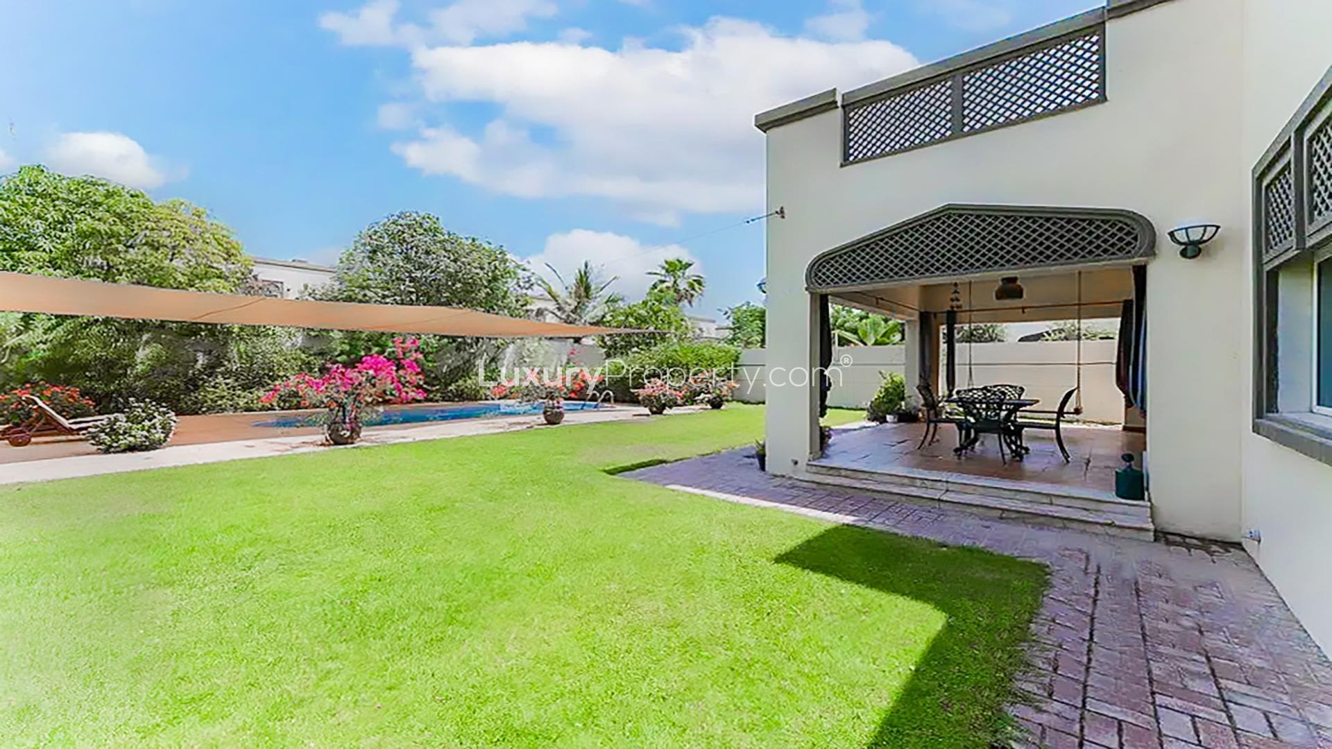 Luxurious Jumeirah Park villa with private pool, lush garden, and modern architecture for sale