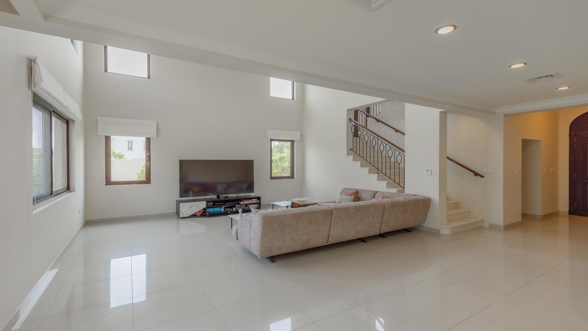 Modern living room in 4-bedroom villa, Rosa, Arabian Ranches 2, featuring cozy sectional sofa